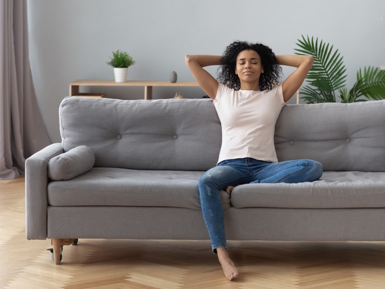 Mindfulness Therapy San Diego, CA Woman Relaxing on Couch